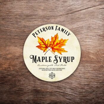 Customizable maple syrup label featuring two maple leaves on a vintage paper background. The label in this photo shows a round label. All text on the label is customizable.